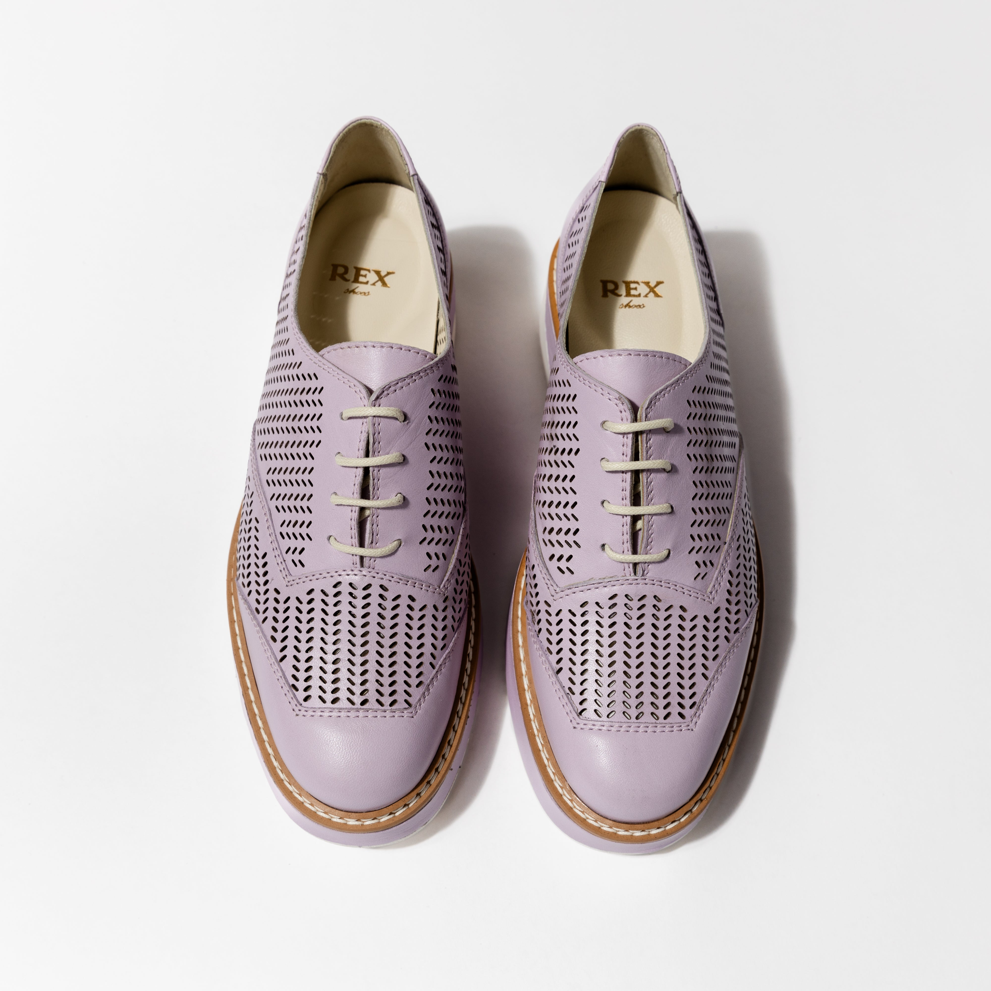 Overhead shot of the &#39;Liz&#39; Oxford, capturing the full lavender hue and the unique design of the lightweight TPU outsole with brand details.